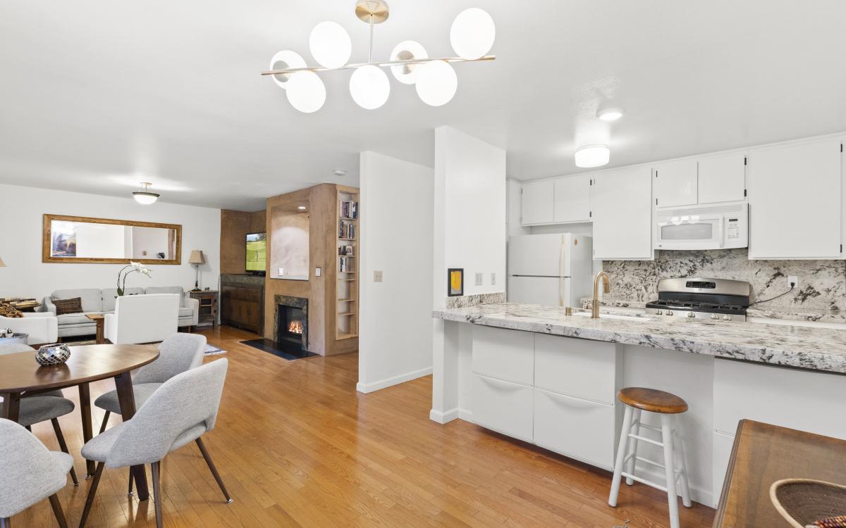 Interior photo of kitchen dining living spaces