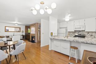 Interior photo of kitchen dining living spaces
